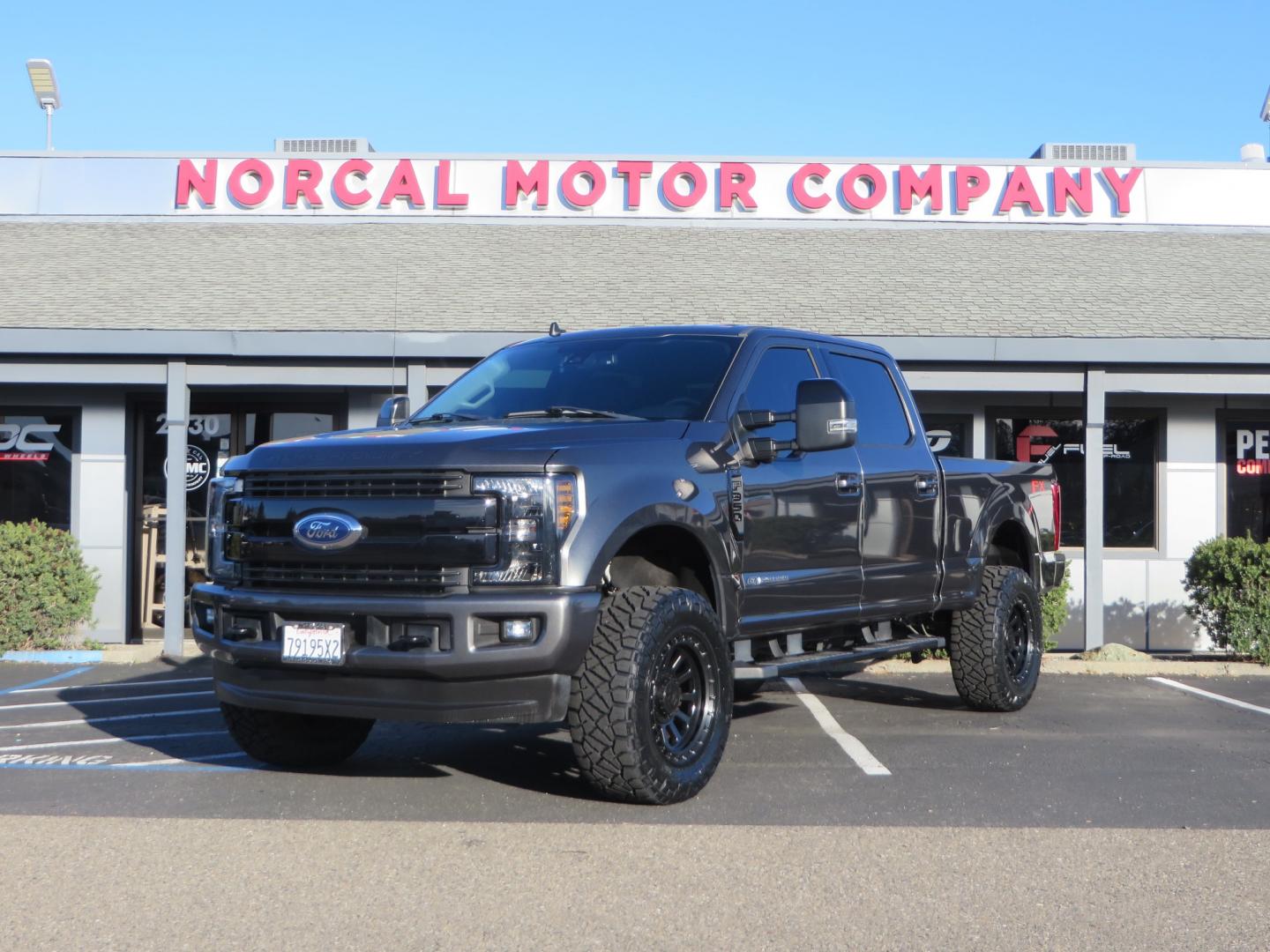 2019 CHARCOAL /BLACK Ford F-350 SD Lariat Crew Cab 4WD (1FT8W3BT7KE) with an 6.7L V8 OHV 16V DIESEL engine, 6A transmission, located at 2630 Grass Valley Highway, Auburn, CA, 95603, (530) 508-5100, 38.937893, -121.095482 - Leveled Superduty sitting on 20" XD series wheels, 35" Nitto Ridge Grappler tires, window tint, and has Firestone Air bags. - Photo#0